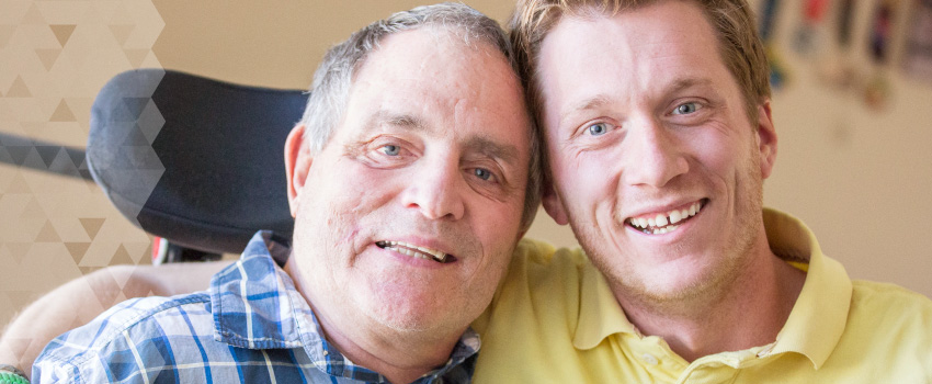 Jim and Scott smile together.