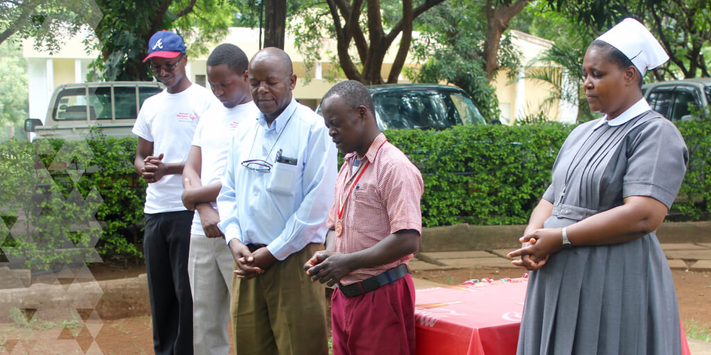 Jonathan leads a group of people in prayer.