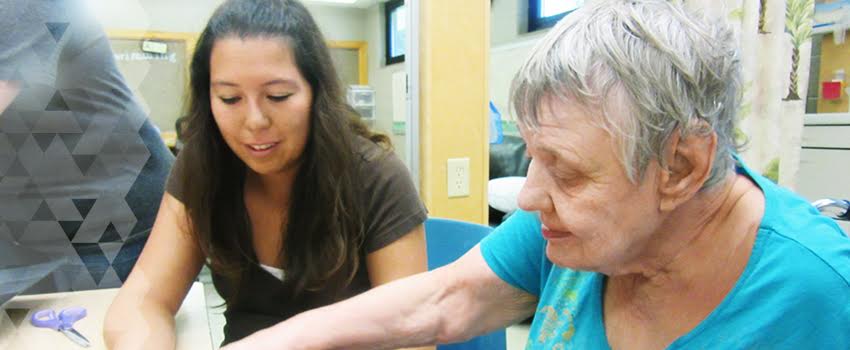 Dara Stull interacts with Barbara Kenney at Mosaic in Axtell.